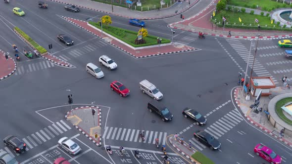 Time lapse of aerial view of intersection or junction with cars traffic, Bangkok Downtown