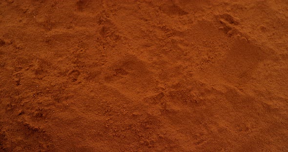 Almonds Falling in Black Chocolate Powder, Slow Motion 4K alt