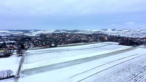 Snow-covered Empty Vineyards Near Zistersdorf Neighborhood At Winter In Lower Austria. - aerial alt