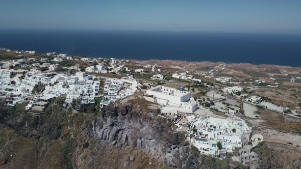 Santorini Aerial View Video of Greek Island with White Houses and Blue Roofs on Sunset and in the alt