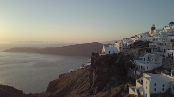 Santorini Aerial View Video of Greek Island with White Houses and Blue Roofs on Sunset and in the