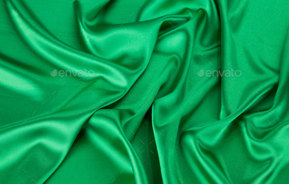 Green silk cloth with some soft folds. Stock Photo by indigolotos