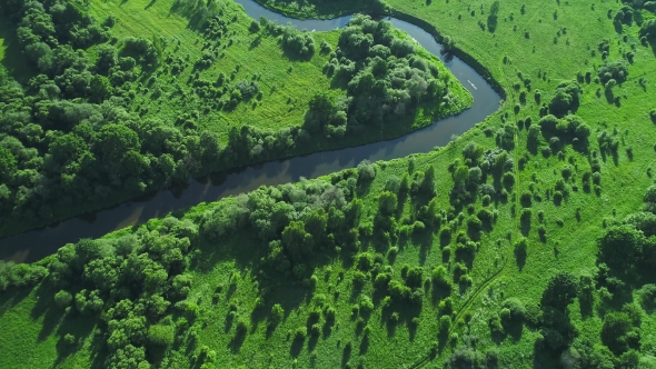 Flight Over River in Meadows