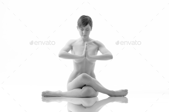 Young Fit Nude Woman Stretching On The Floor Isolated Stock Photo