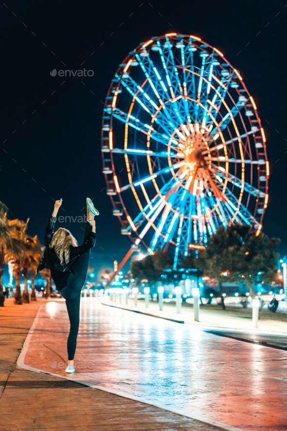 Girl In The Background Of The Amusement Park Stock Photo By Simbiothy