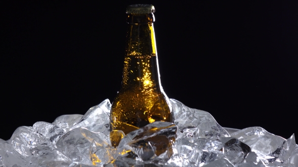 Bottle with a Tempo Drink, They Are for Oktoberfest. Black Background. alt