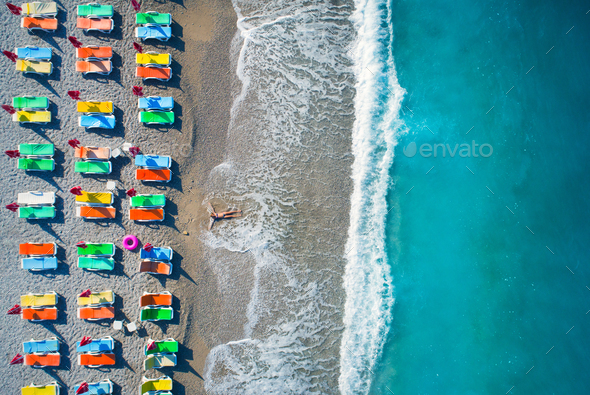Aerial view of lying woman on the beach - Stock Photo - Images