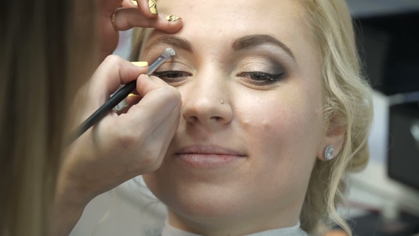 Makeup Artist Makes a Girl Beautiful Makeup Before an Important Event