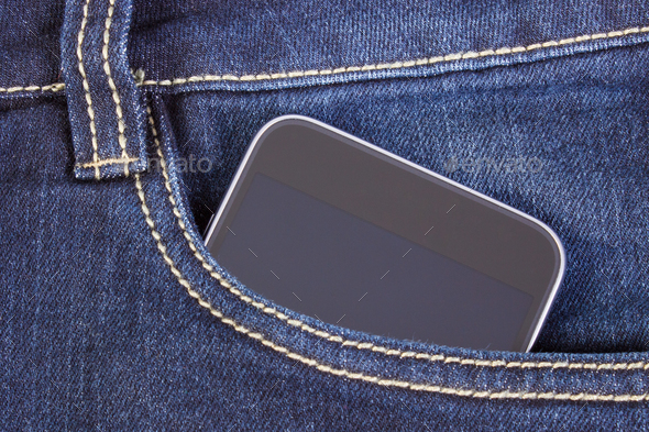 Mobile phone with blank screen in pocket jeans, smartphone