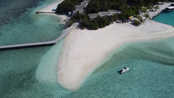 Aerial View of a Tropical Paradise Island Bay Covered in Limestone Trees with Crystal Clear Beach