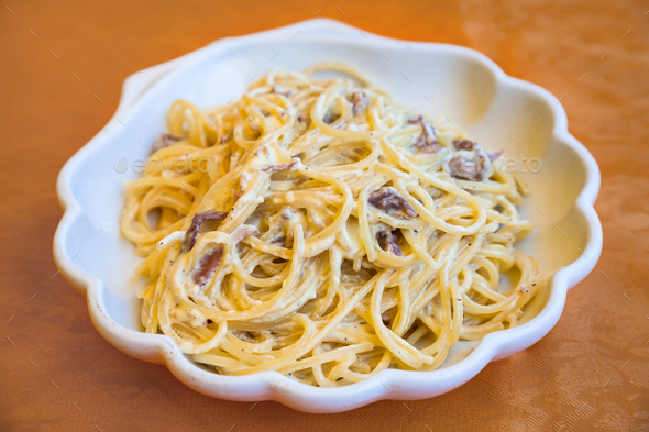 spaghetti alla carbonara on plate in Sicily