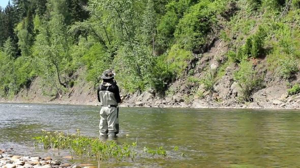Man Catches Fish in the River