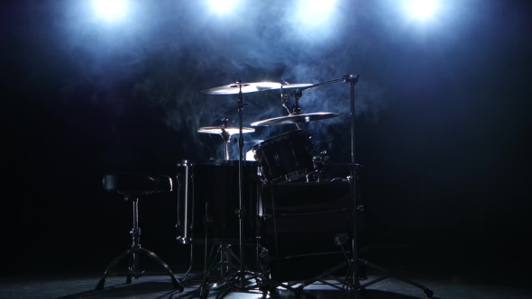 Professional Drum Set with Chair. Black Smoky Background. Back Light. Side View alt