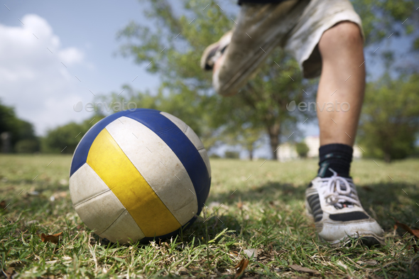 Kids Playing Soccer Game Young Boy Hitting Ball In Park Stock Photo By 