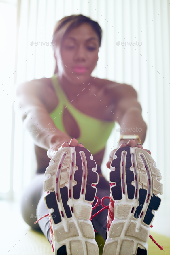 Home Fitness Black Woman Doing Legs Stretching On Pad - Stock Photo - Images