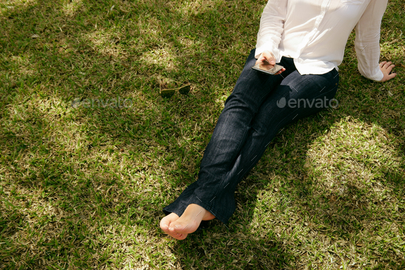 High Angle Woman Texting Mobile Phone Sitting Grass Park - Stock Photo - Images