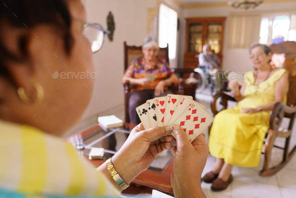 Old Women Have Fun Playing Card Game In Hospice