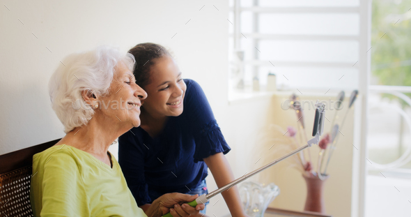 Generations Gap Happy Old Woman And Granddaughter Taking Selfie