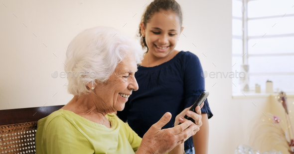 Girl Helps Old Woman Using Mobile Phone And Technology