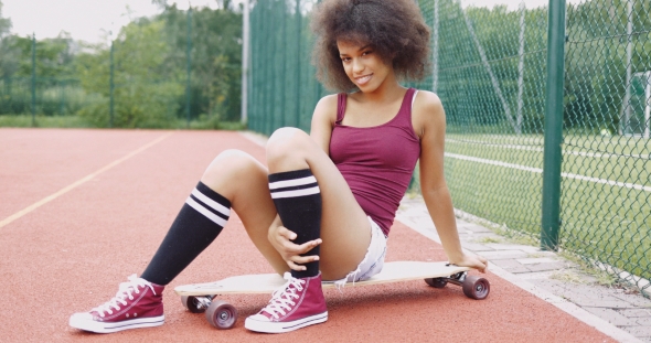 Flirty Woman on Skateboard alt