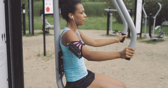 Sportswoman Training in Park alt