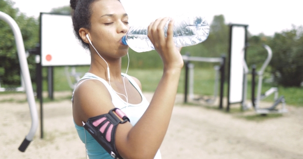 Girl Drinking After Workout alt