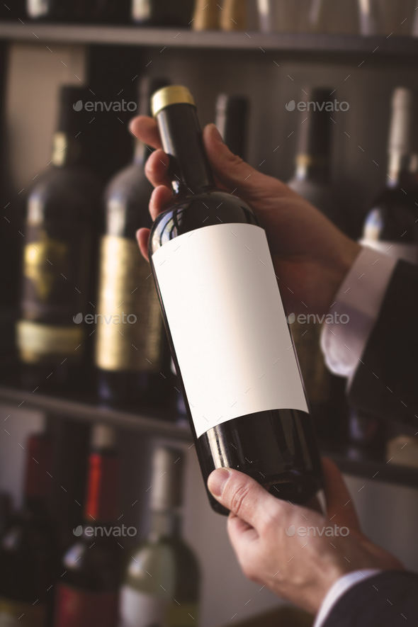 hands selling wine in winestore