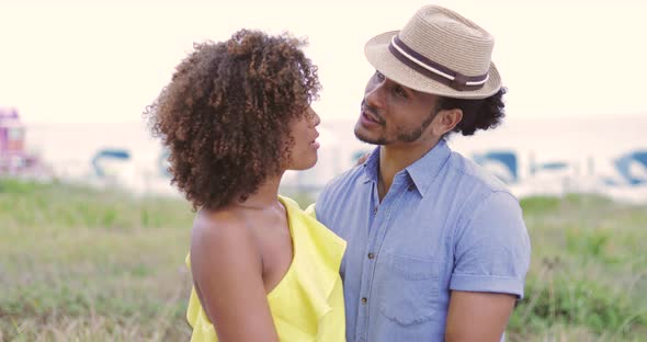 Cheerful Couple Standing Together on Street alt