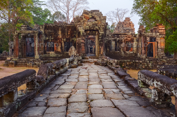 Textured stone road and ancient temple ruins in Angkor Wat