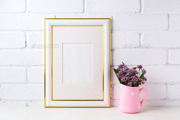 Gold decorated frame mockup with purple flowers in pink rustic p