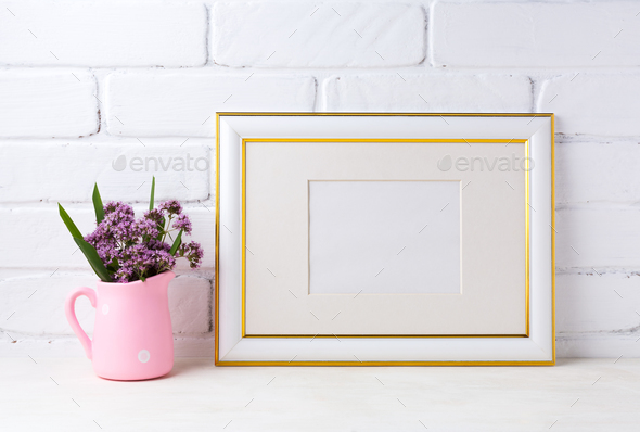 Gold decorated landscape frame mockup with purple flowers in pin