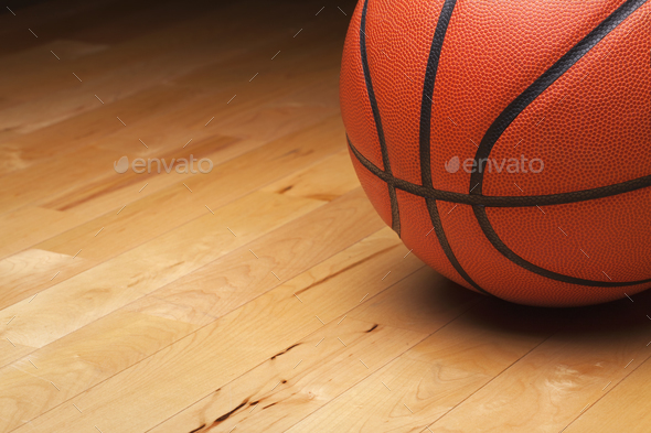 Basketball on a Maple Hardwood Court Floor - Stock Photo - Images
