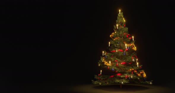 Christmas xmas tree decorated with balls, lights, fluffy ribbons and candles