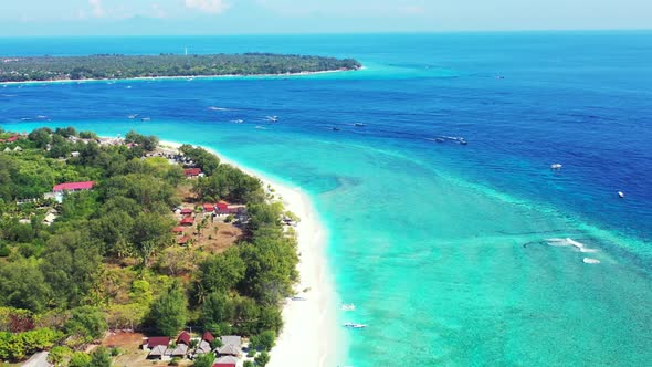 Aerial drone shot panorama of perfect coastline beach trip by blue sea and white sand background of  alt