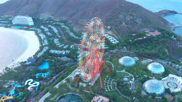 Video Footage with Ferris Wheel Lights in the Evening Amusement Park. Ferris Wheel Lights. alt
