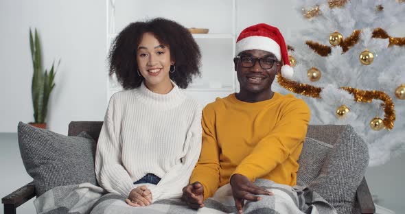 Webcam View of African American Couple in Winter Sweaters and Christmas ...