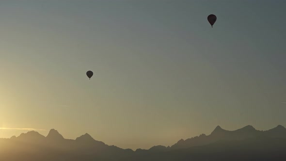 Two Balloons Fly Along the Mountains