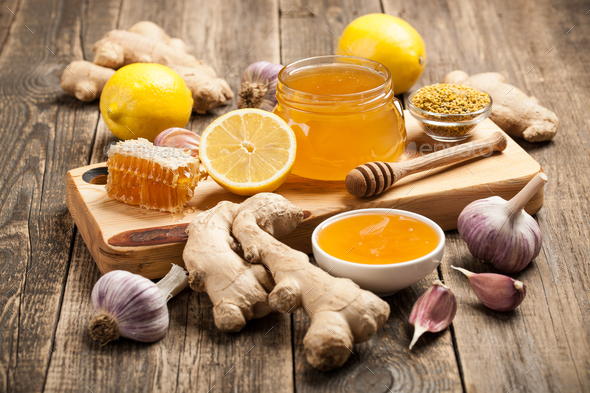 Healthy food table with honey, ginger, garlic and lemon