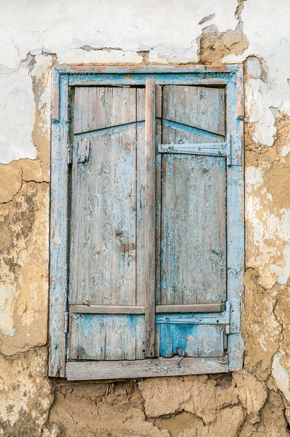 Old wooden window shutters on the background of the destroyed wa - Stock Photo - Images