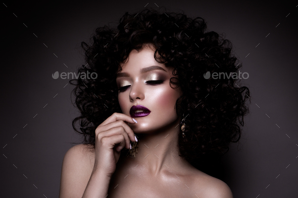 Glamour lady, Beautiful Girl on gray background. Portrait. Wavy Hair, perfect make up. Closed eyes.