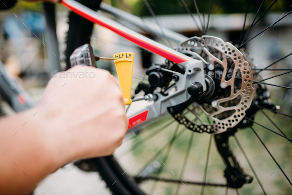 Bicycle mechanic hands with service tools - Stock Photo - Images