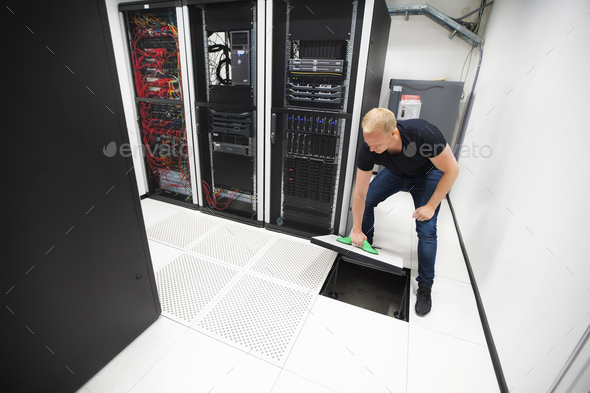 Computer Engineer Lifting Floor Tile Using Suction Cups In Datac Computer Engineer Lifting Floor Tile Using Suction Cups In Datac Stock Photo Images