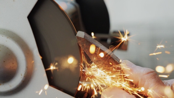Worker Sharpening Tools By Grinding Wheel alt