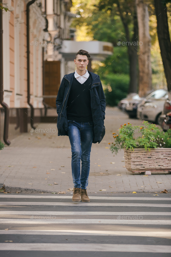 Hipster guy walking down the street, urban style Stock Photo by ...