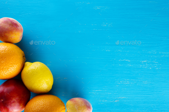 Fresh raw fruits on a blue wooden background - Stock Photo - Images