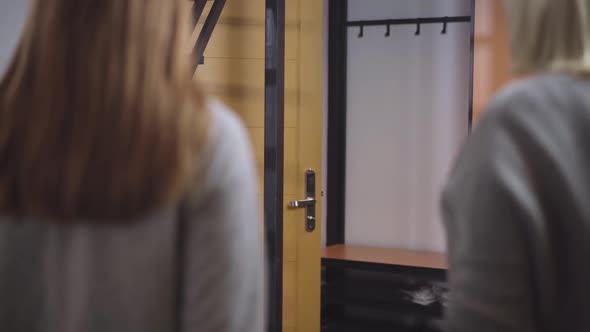 Confident Handsome Caucasian Man Returning Home or Joining Family in Hotel. Portrait of Father and alt