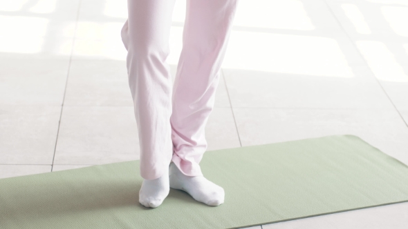 Shooting Exercises Yoga . Sporty Girl Doing Exercises on Mate. Magnificent Stretching and Stability