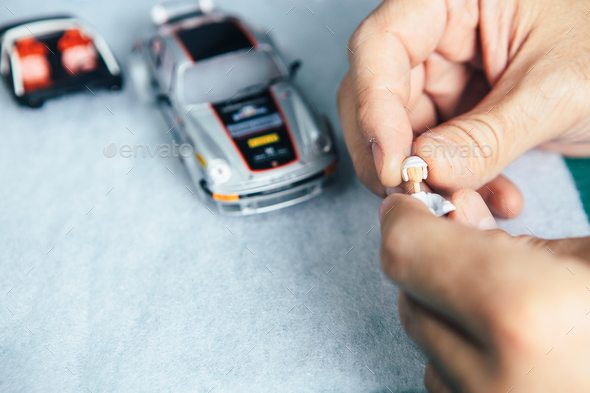 Master plugging head on driver toy Stock Photo by Click_and_Photo ...