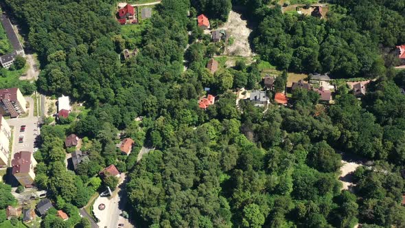 European City with New Houses and Construction Site with Unfinished Building alt