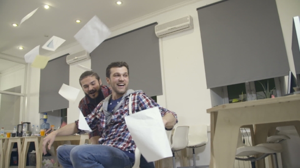 Young Guys Have Fun in the Office During a Break alt